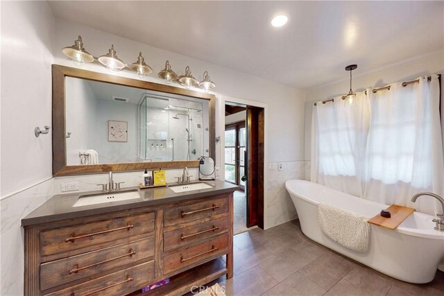 2289 Falcon Ridge Ln, Los Osos, CA 93402 - bathroom featuring a shower stall, tile walls, double vanity, a soaking tub, and tile patterned floors