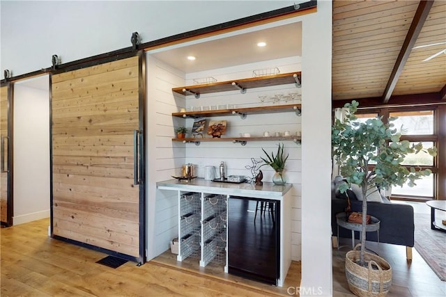 2289 Falcon Ridge Ln, Los Osos, CA 93402 - bar featuring a barn door, light wood-style floors, a wooden ceiling with exposed beams, and recessed lighting