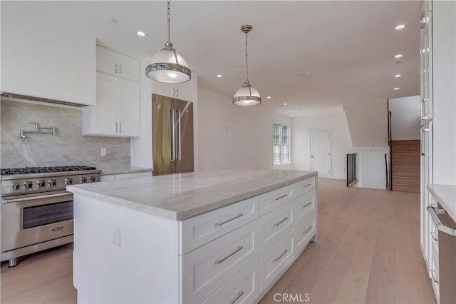 3803 Berryman Ave, Los Angeles, CA 90066 - kitchen with premium appliances, tasteful backsplash, recessed lighting, light wood-style floors, and a kitchen island