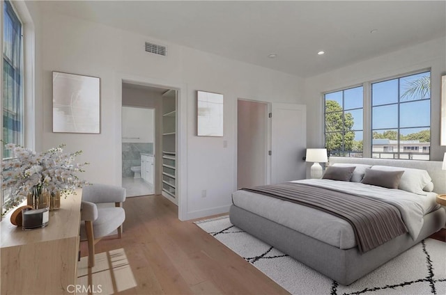3803 Berryman Ave, Los Angeles, CA 90066 - bedroom with wood finished floors, baseboards, recessed lighting, and connected bathroom