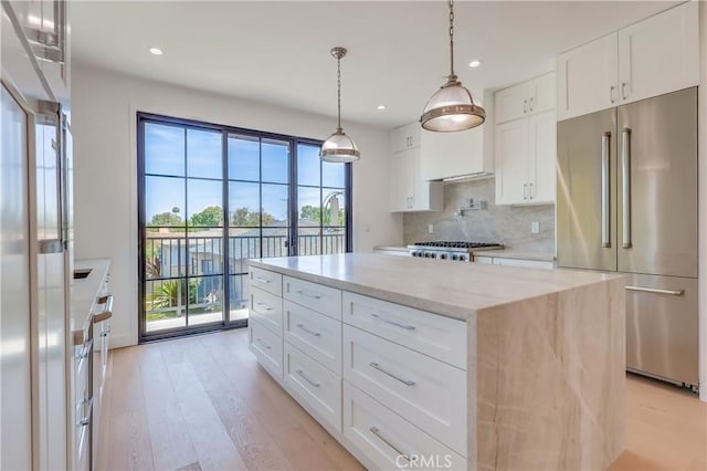 3803 Berryman Ave, Los Angeles, CA 90066 - kitchen with high end fridge, plenty of natural light, tasteful backsplash, white cabinets, and recessed lighting