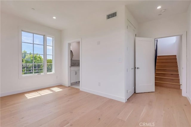 3803 Berryman Ave, Los Angeles, CA 90066 - empty room featuring light wood finished floors, stairway, baseboards, and recessed lighting