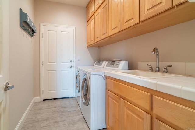 30646 Red Hawk Rd, Valley Center, CA 92082 - washroom with cabinet space, independent washer and dryer, and light wood-style floors
