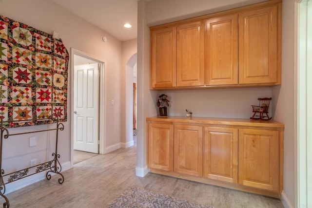 30646 Red Hawk Rd, Valley Center, CA 92082 - bar area featuring arched walkways, light wood-style flooring, and recessed lighting