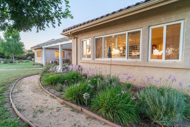 30646 Red Hawk Rd, Valley Center, CA 92082 - view of side of home with stucco siding and a lawn