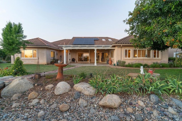 30646 Red Hawk Rd, Valley Center, CA 92082 - back of house featuring a patio, a tiled roof, stucco siding, and roof mounted solar panels