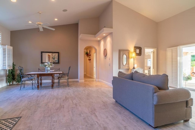 30646 Red Hawk Rd, Valley Center, CA 92082 - living room with high vaulted ceiling, arched walkways, ceiling fan, wood finished floors, and recessed lighting