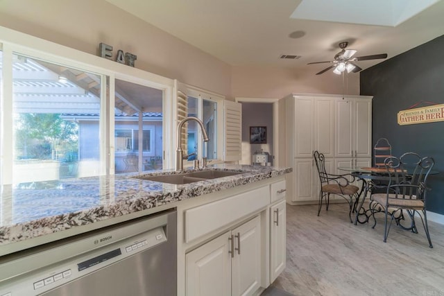30646 Red Hawk Rd, Valley Center, CA 92082 - kitchen with dishwasher, ceiling fan, light stone counters, light wood-type flooring, and white cabinets