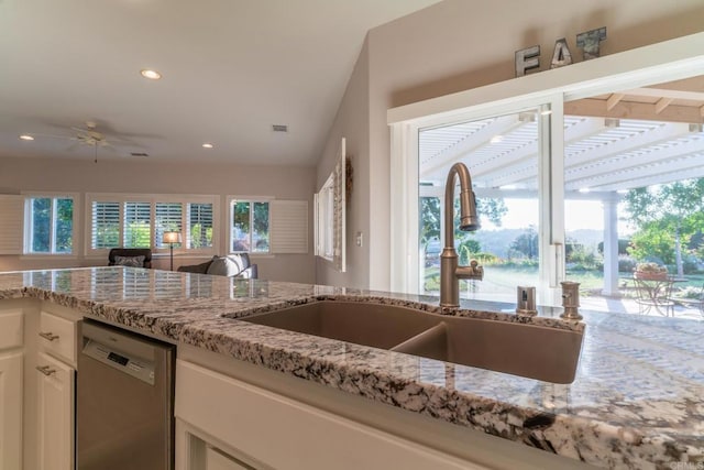30646 Red Hawk Rd, Valley Center, CA 92082 - kitchen with stainless steel dishwasher, light stone counters, recessed lighting, a ceiling fan, and white cabinets