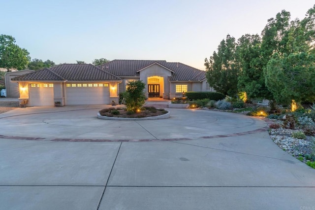 30646 Red Hawk Rd, Valley Center, CA 92082 - ranch-style home with a tiled roof, curved driveway, a garage, and stucco siding