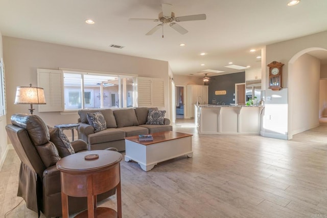 30646 Red Hawk Rd, Valley Center, CA 92082 - living room featuring ceiling fan, arched walkways, light wood finished floors, and recessed lighting