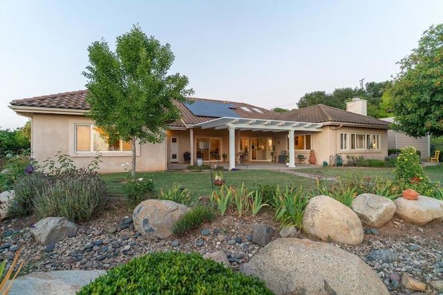30646 Red Hawk Rd, Valley Center, CA 92082 - back of property with a tile roof, solar panels, a yard, stucco siding, and a patio area