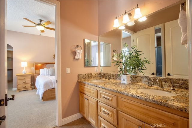 41380 La Sierra Rd, Temecula, CA 92591 - ensuite bathroom with double vanity, ceiling fan, and baseboards