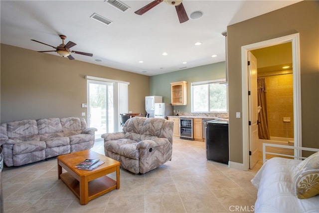 41380 La Sierra Rd, Temecula, CA 92591 - living area with ceiling fan, beverage cooler, light tile patterned floors, bar area, and recessed lighting