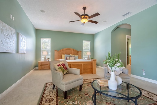 41380 La Sierra Rd, Temecula, CA 92591 - carpeted bedroom with arched walkways, multiple windows, baseboards, and a ceiling fan