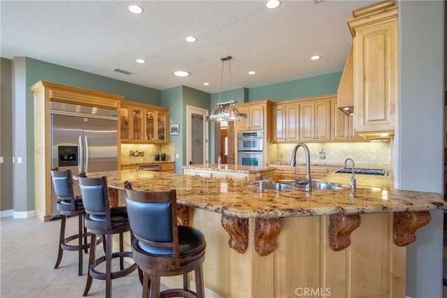 41380 La Sierra Rd, Temecula, CA 92591 - kitchen featuring stainless steel appliances, a peninsula, a sink, recessed lighting, and decorative backsplash