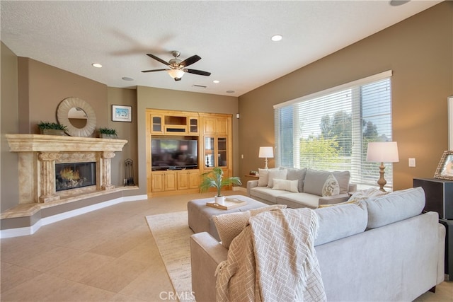 41380 La Sierra Rd, Temecula, CA 92591 - living area featuring ceiling fan, a premium fireplace, recessed lighting, and light tile patterned floors