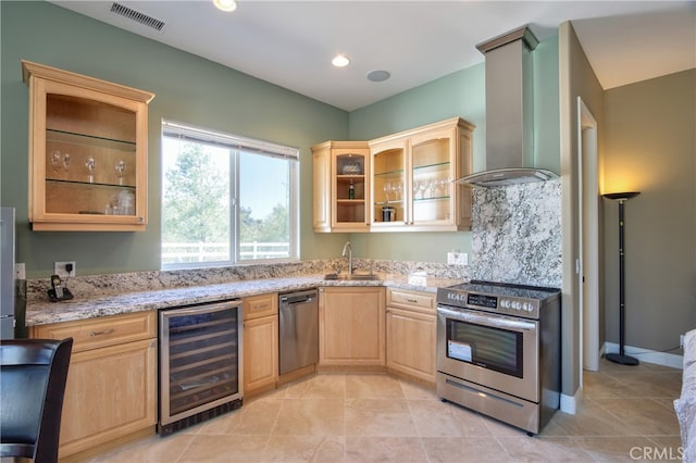 41380 La Sierra Rd, Temecula, CA 92591 - kitchen with stainless steel appliances, wall chimney range hood, wine cooler, light brown cabinets, and a sink