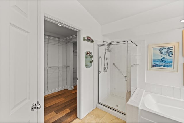 11964 Ashley Pl, San Diego, CA 92128 - full bath featuring a shower stall, a garden tub, a spacious closet, and wood finished floors