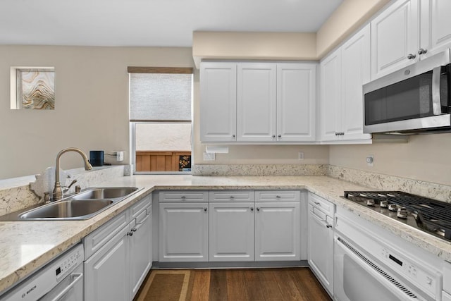11964 Ashley Pl, San Diego, CA 92128 - kitchen with appliances with stainless steel finishes, dark wood finished floors, white cabinetry, and light stone counters