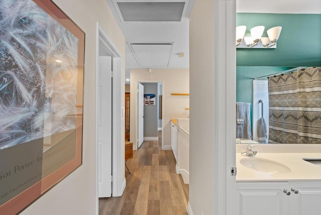 11964 Ashley Pl, San Diego, CA 92128 - hall with attic access and wood finished floors
