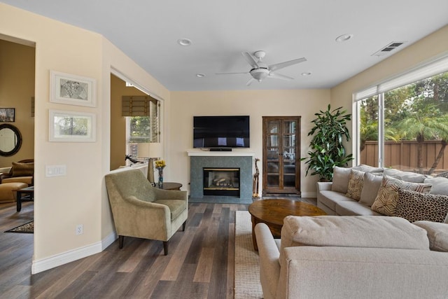 11964 Ashley Pl, San Diego, CA 92128 - living area with dark wood-style floors, a premium fireplace, a ceiling fan, and recessed lighting