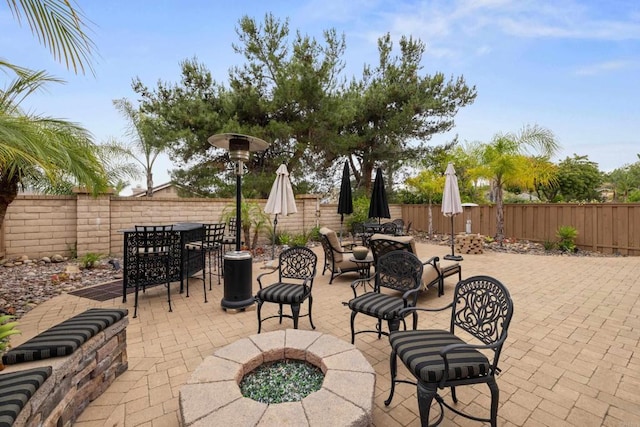 11964 Ashley Pl, San Diego, CA 92128 - fenced backyard featuring a fire pit, a patio, and outdoor dining space