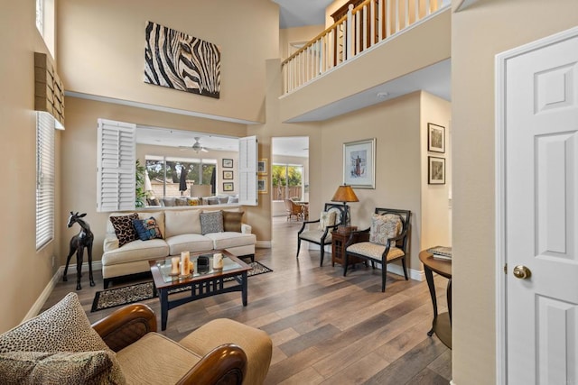11964 Ashley Pl, San Diego, CA 92128 - living room featuring wood finished floors, ceiling fan, and a high ceiling