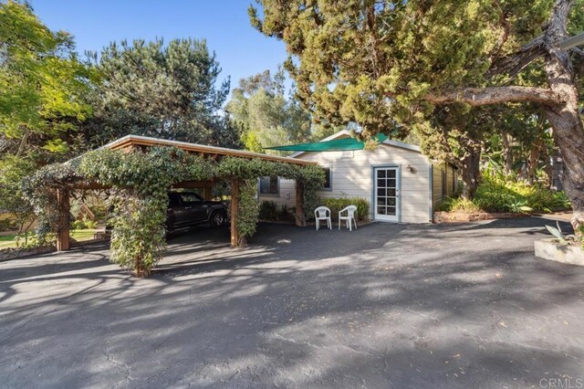 10880 Hess Dr, La Mesa, CA 91941 - exterior space featuring a carport and an outdoor structure