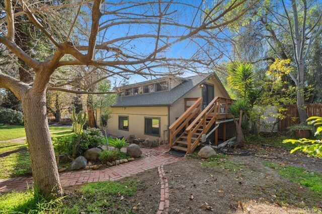 10880 Hess Dr, La Mesa, CA 91941 - back of property with stairs, stucco siding, a wooden deck, and a shingled roof