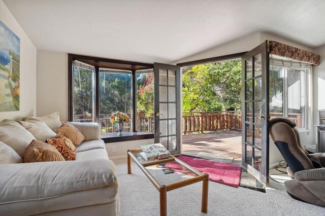 10880 Hess Dr, La Mesa, CA 91941 - living room featuring vaulted ceiling, healthy amount of natural light, carpet flooring, and french doors