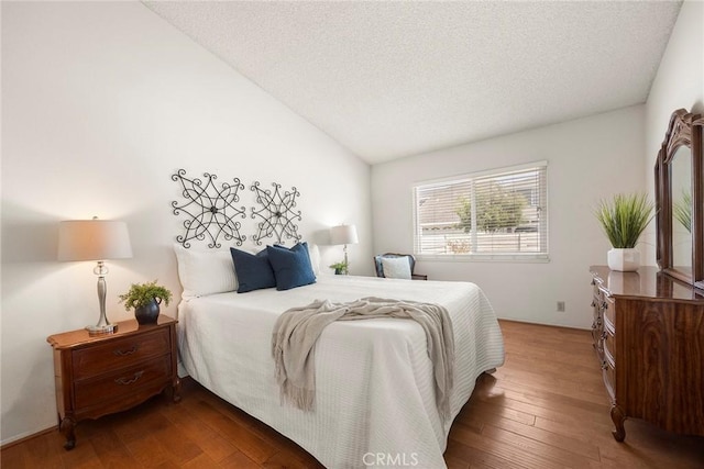 77 S Havenwood Unit 27, Irvine, CA 92614 - bedroom featuring vaulted ceiling, wood finished floors, and a textured ceiling