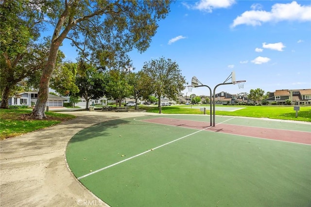 77 S Havenwood Unit 27, Irvine, CA 92614 - view of basketball court featuring a residential view, a lawn, and community basketball court
