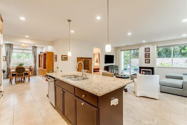 1055 Ford Dr, Nipomo, CA 93444 - kitchen with open floor plan, plenty of natural light, a center island with sink, light tile patterned floors, and recessed lighting