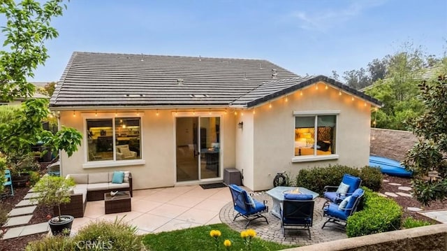 1055 Ford Dr, Nipomo, CA 93444 - rear view of property featuring an outdoor living space with a fire pit, stucco siding, a patio, and a tile roof