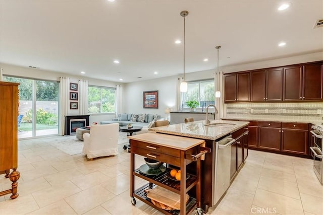 1055 Ford Dr, Nipomo, CA 93444 - kitchen featuring dishwasher, decorative backsplash, light stone counters, light tile patterned flooring, and an island with sink