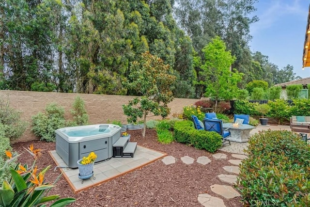 1055 Ford Dr, Nipomo, CA 93444 - fenced backyard with a hot tub, a patio area, and a fire pit