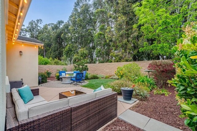 1055 Ford Dr, Nipomo, CA 93444 - view of patio featuring an outdoor living space and view of wooded area