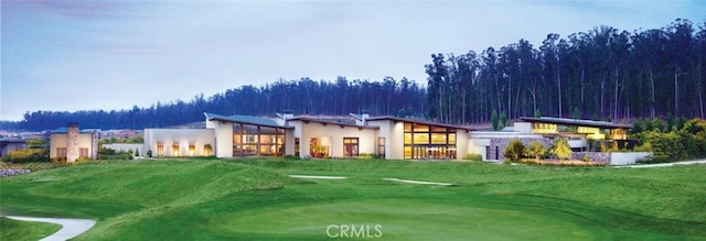 1055 Ford Dr, Nipomo, CA 93444 - rear view of house featuring stucco siding, golf course view, and a lawn