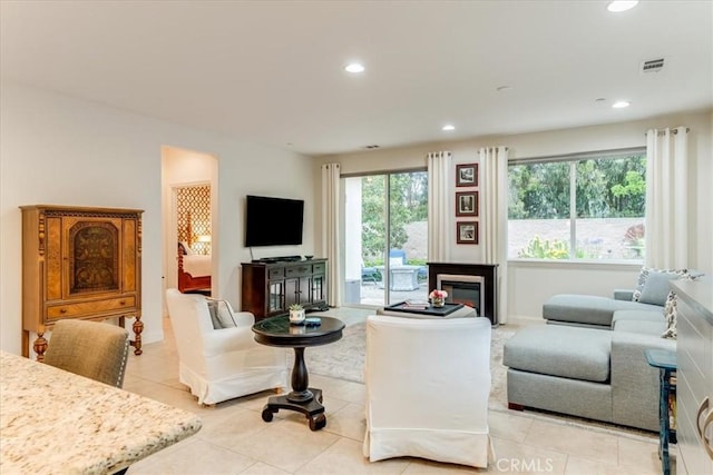1055 Ford Dr, Nipomo, CA 93444 - living area featuring light tile patterned floors, recessed lighting, and a glass covered fireplace