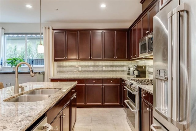 1055 Ford Dr, Nipomo, CA 93444 - kitchen featuring premium appliances, decorative backsplash, decorative light fixtures, recessed lighting, and light stone counters