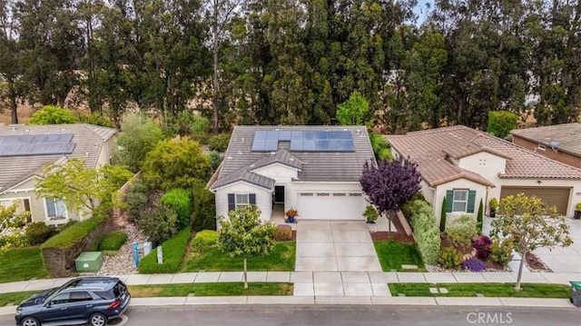 1055 Ford Dr, Nipomo, CA 93444 - view of front of property with driveway, a tiled roof, roof mounted solar panels, and an attached garage