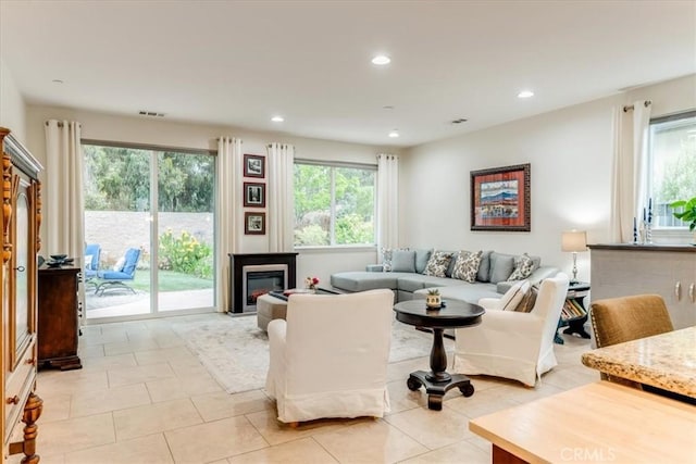 1055 Ford Dr, Nipomo, CA 93444 - living area featuring recessed lighting, light tile patterned floors, and a glass covered fireplace