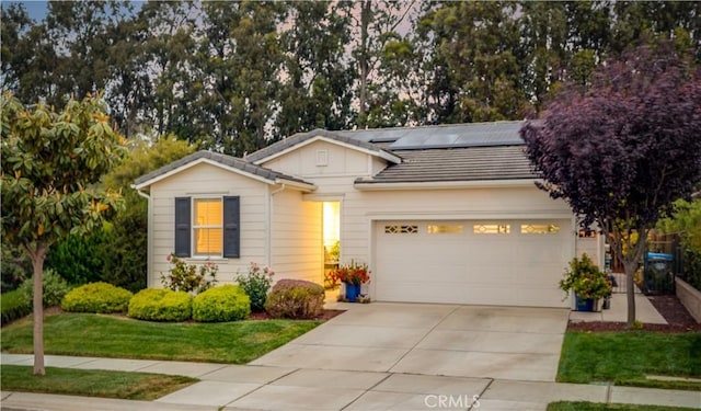1055 Ford Dr, Nipomo, CA 93444 - ranch-style home with driveway, solar panels, an attached garage, and a tile roof