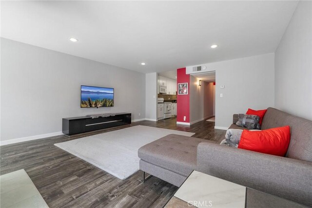 14506 Benefit St Unit 103, Sherman Oaks, CA 91403 - living room with dark wood-style flooring, baseboards, and recessed lighting