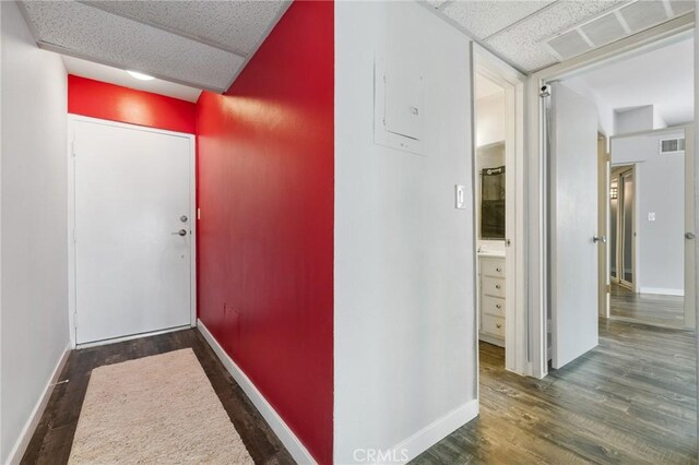 14506 Benefit St Unit 103, Sherman Oaks, CA 91403 - hallway with wood finished floors, baseboards, and a drop ceiling