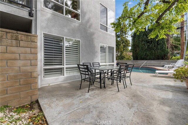 14506 Benefit St Unit 103, Sherman Oaks, CA 91403 - view of patio / terrace with outdoor dining area
