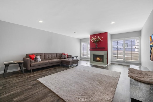 14506 Benefit St Unit 103, Sherman Oaks, CA 91403 - living room with dark wood finished floors, a fireplace with flush hearth, baseboards, and recessed lighting