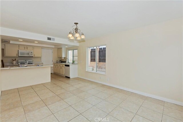 7605 Pasito Ave, Rancho Cucamonga, CA 91730 - kitchen featuring white appliances, light countertops, a chandelier, baseboards, and recessed lighting