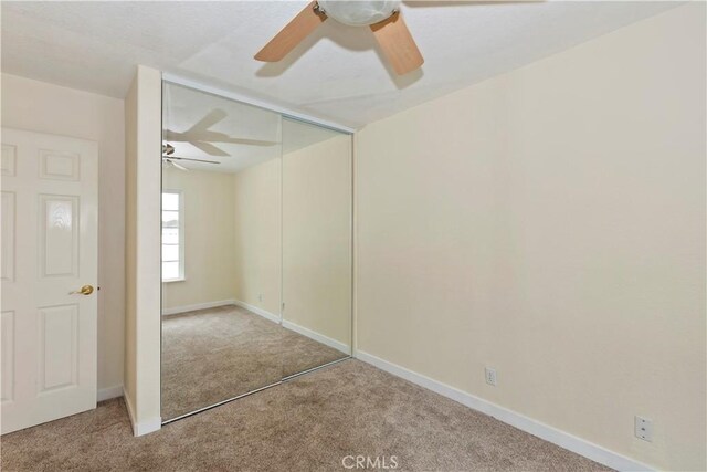 7605 Pasito Ave, Rancho Cucamonga, CA 91730 - unfurnished bedroom featuring carpet, a closet, baseboards, and a ceiling fan